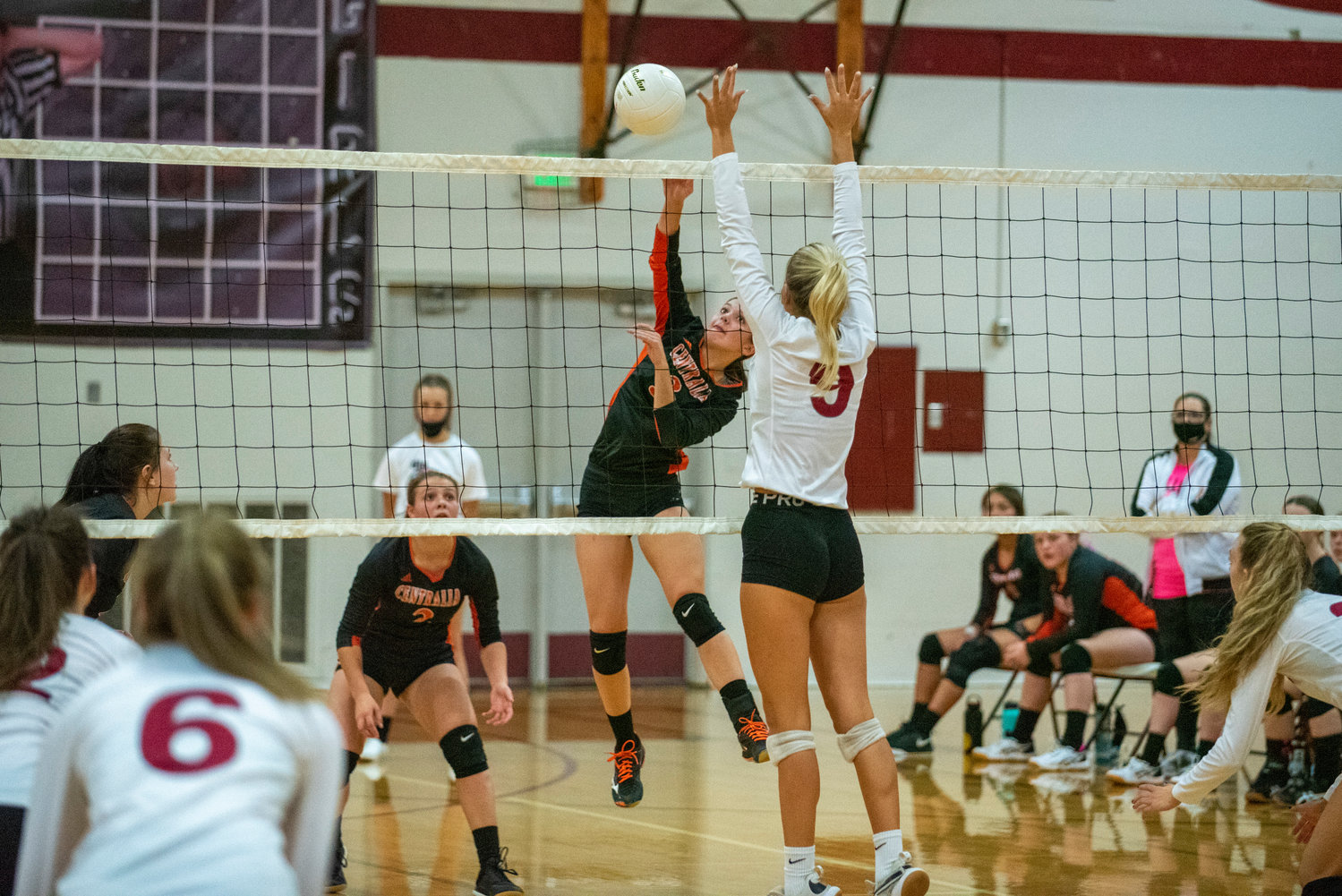 Centralia's Ella Orr (3) spikes the ball past W.F. West's Ava Olsen (9) during the first leg of the Swamp Cup on Tuesday in Chehalis.
