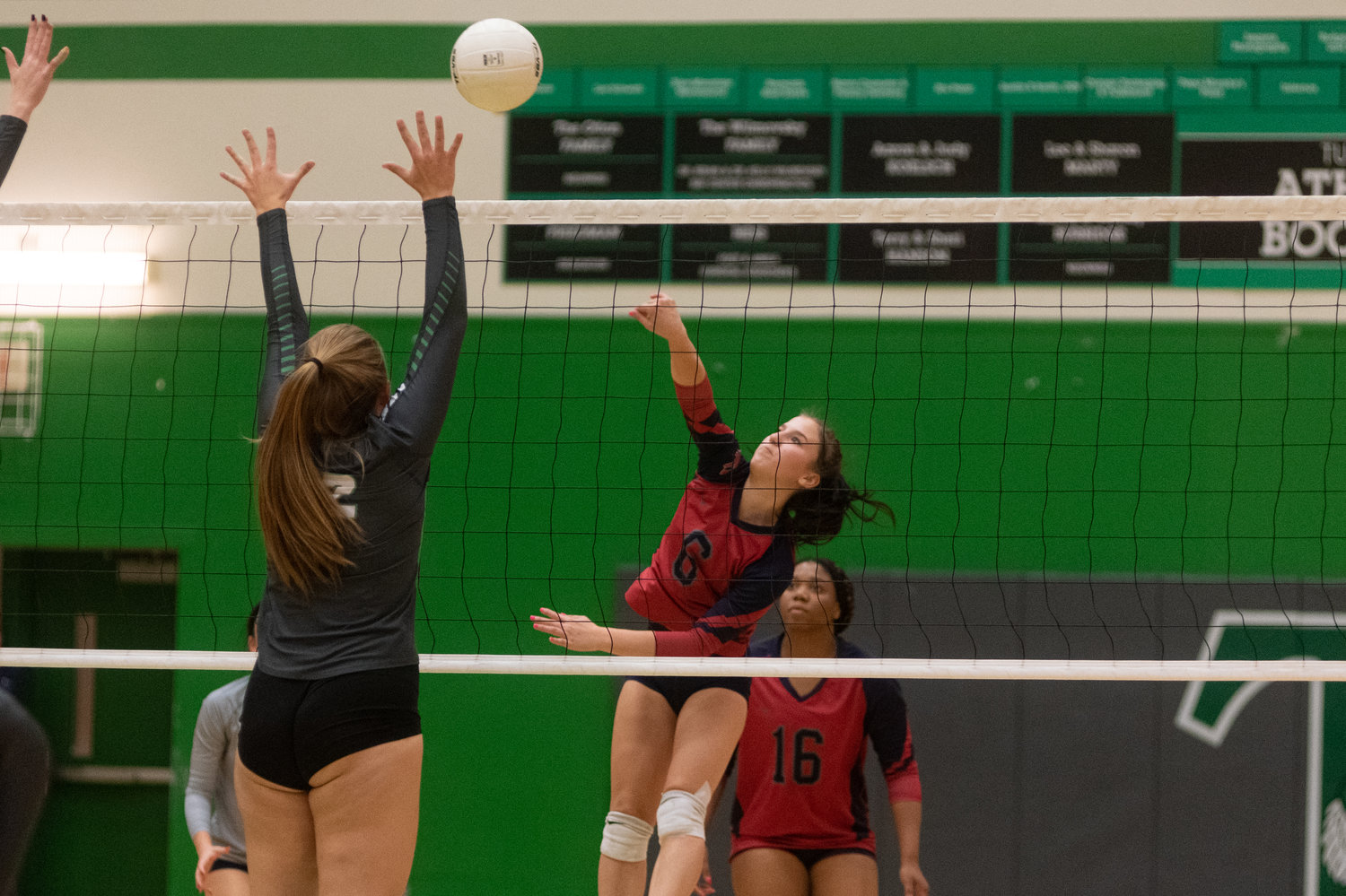 FILE PHOTO -- Black Hills junior Ava Bauer hits the ball across the net against Tumwater Oct. 12.