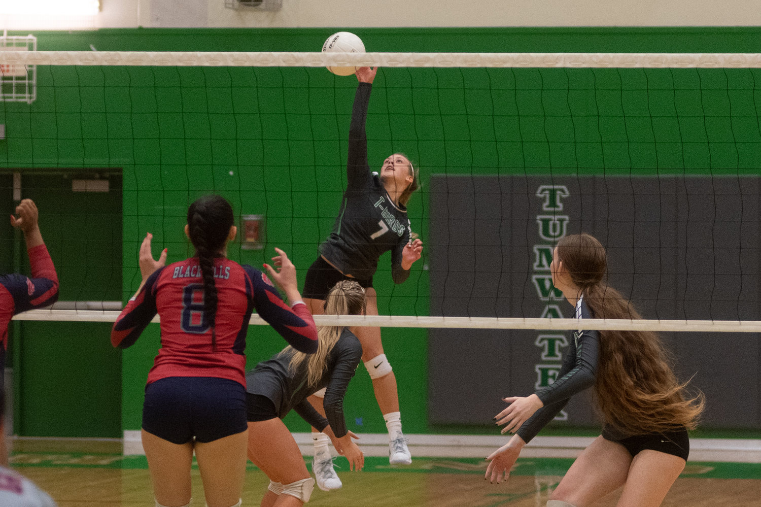 Tumwater sophomore Brooklyn Hayes hits a ball over the net against Black Hills Oct. 12.