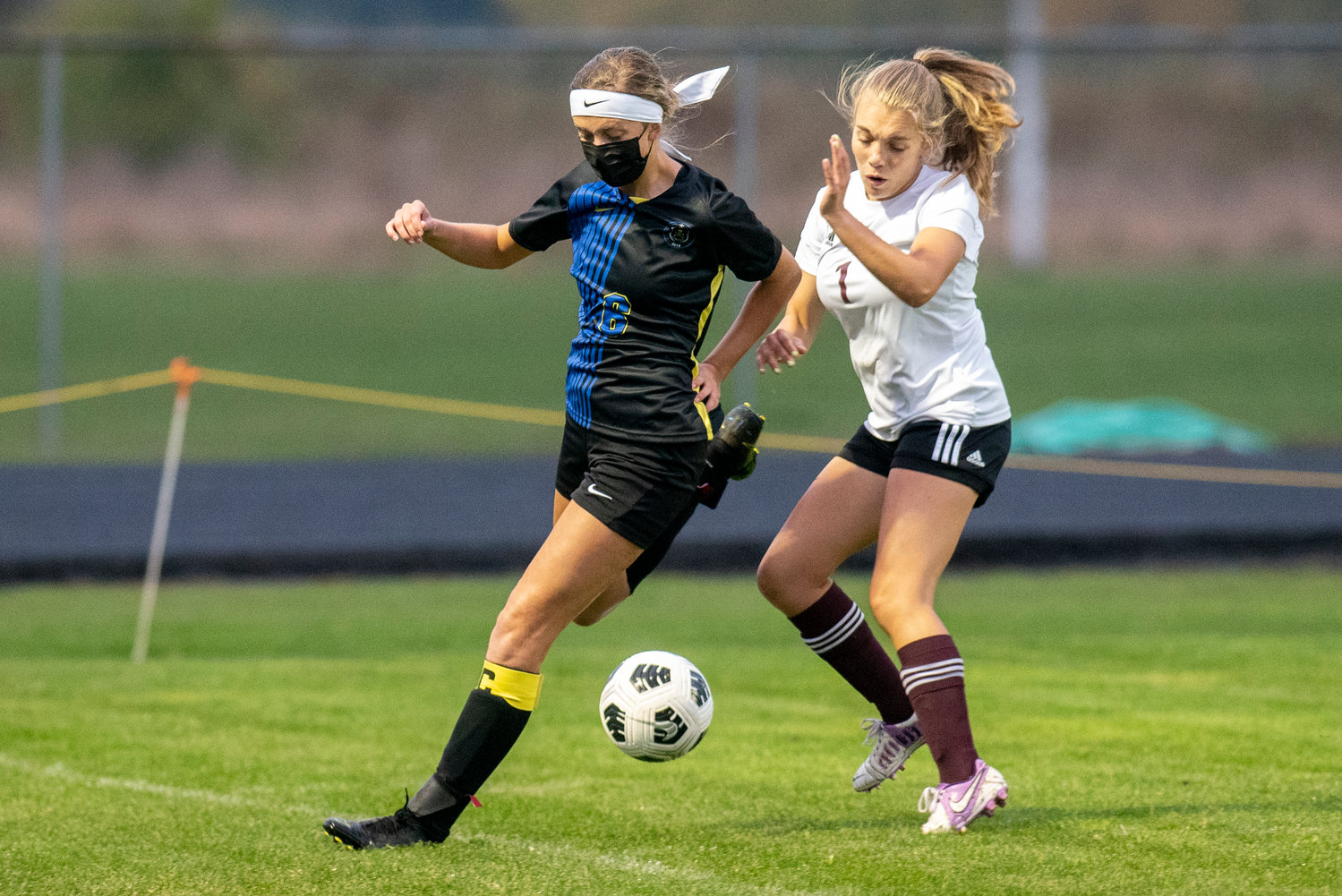 Adna's Madi Stark (6) defends against Raymond-South Bend's Ellie Capps (1) on Oct. 13, 2021.