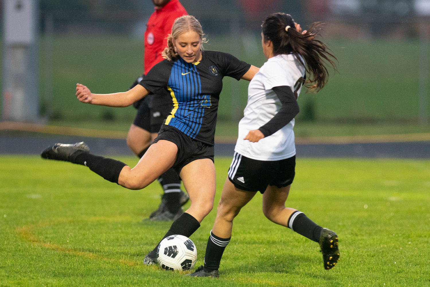 Adna freshman Lydia Tobin (4) boots a pass downfield against Raymond-South Bend on Oct. 13, 2021.