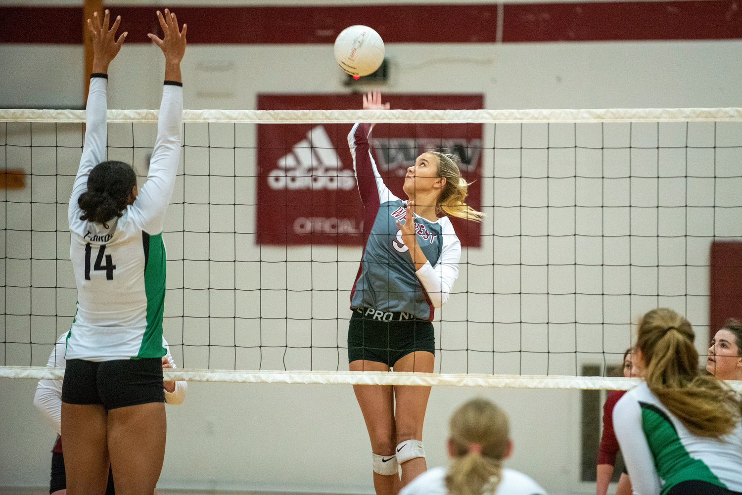 W.F. West's Ava Olsen (9) hammers a spike against Tumwater's Bella Burney (14) on Oct. 14, 2021.