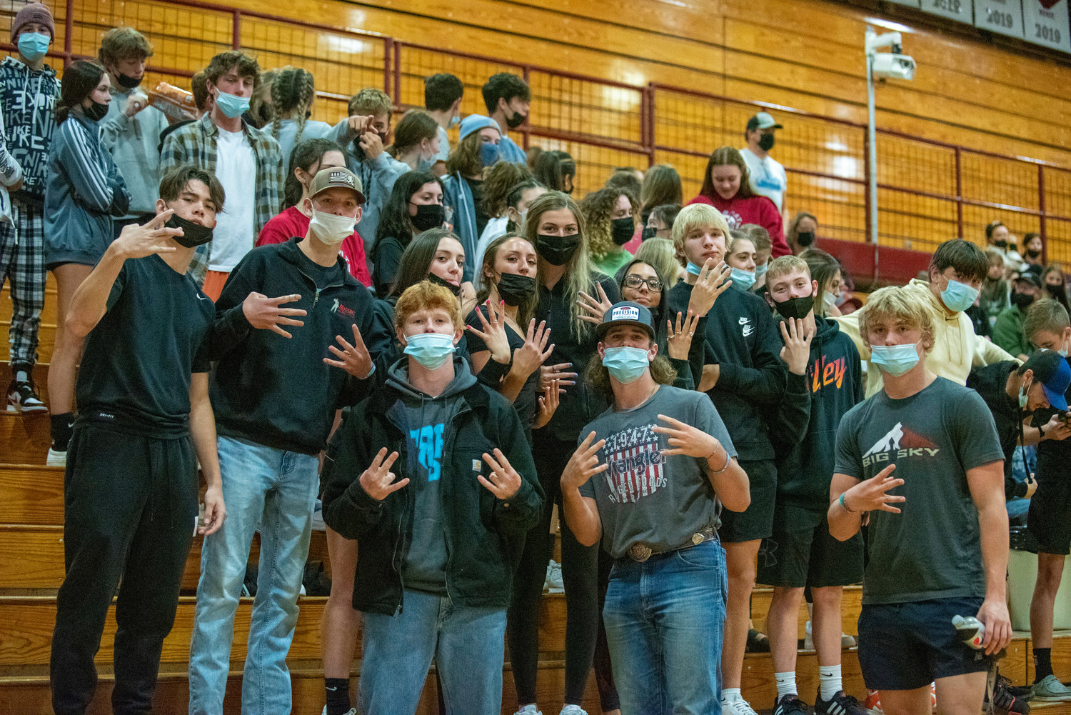 W.F. West's student section poses for a photo during a home volleyball match against Tumwater on Thursday, Oct. 14, 2021.
