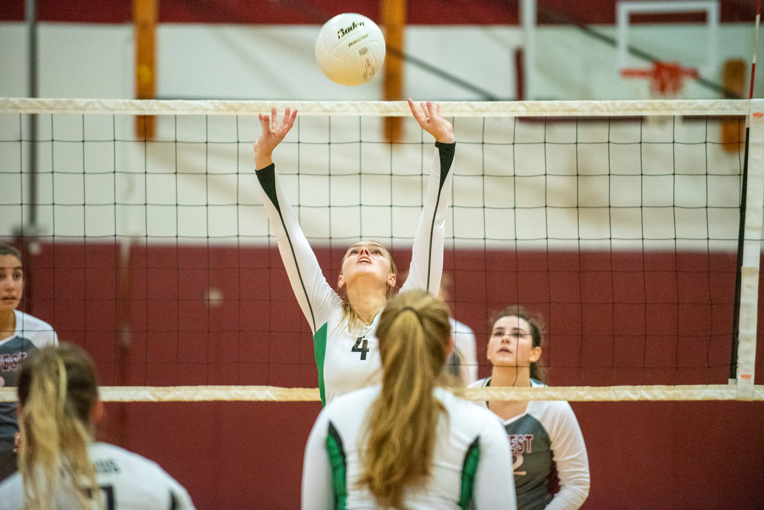 Tumwater's Sydney Hanson (4) sets a ball against W.F. West on Oct. 14, 2021.