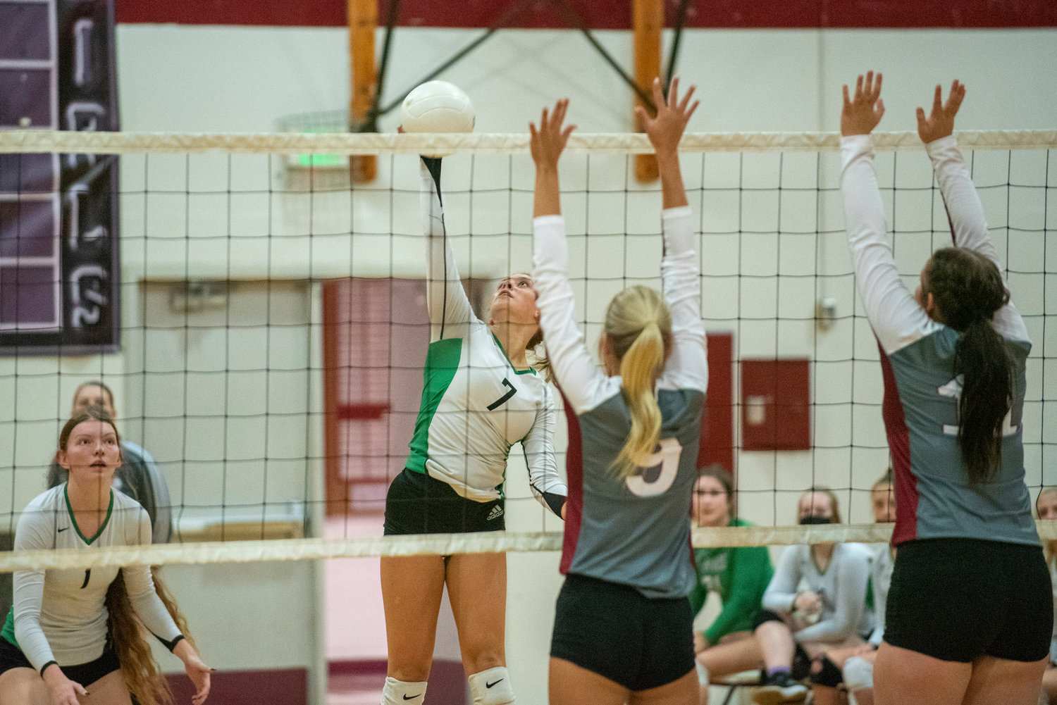 Tumwater's Brooklynn Hayes (7) spikes against W.F. West's front row on Oct. 14, 2021.