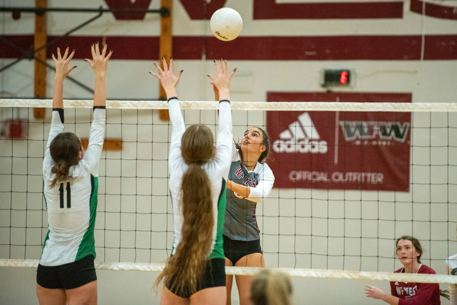 W.F. West's Anna White (8) spikes against Tumwater's Kira Turcotte (11) during a league match on Oct. 14, 2021.