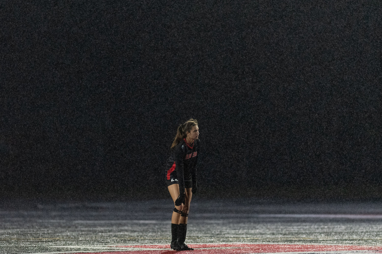 Tenino defender Ashley Schow watches a free kick in the rain against Montesano Oct. 14