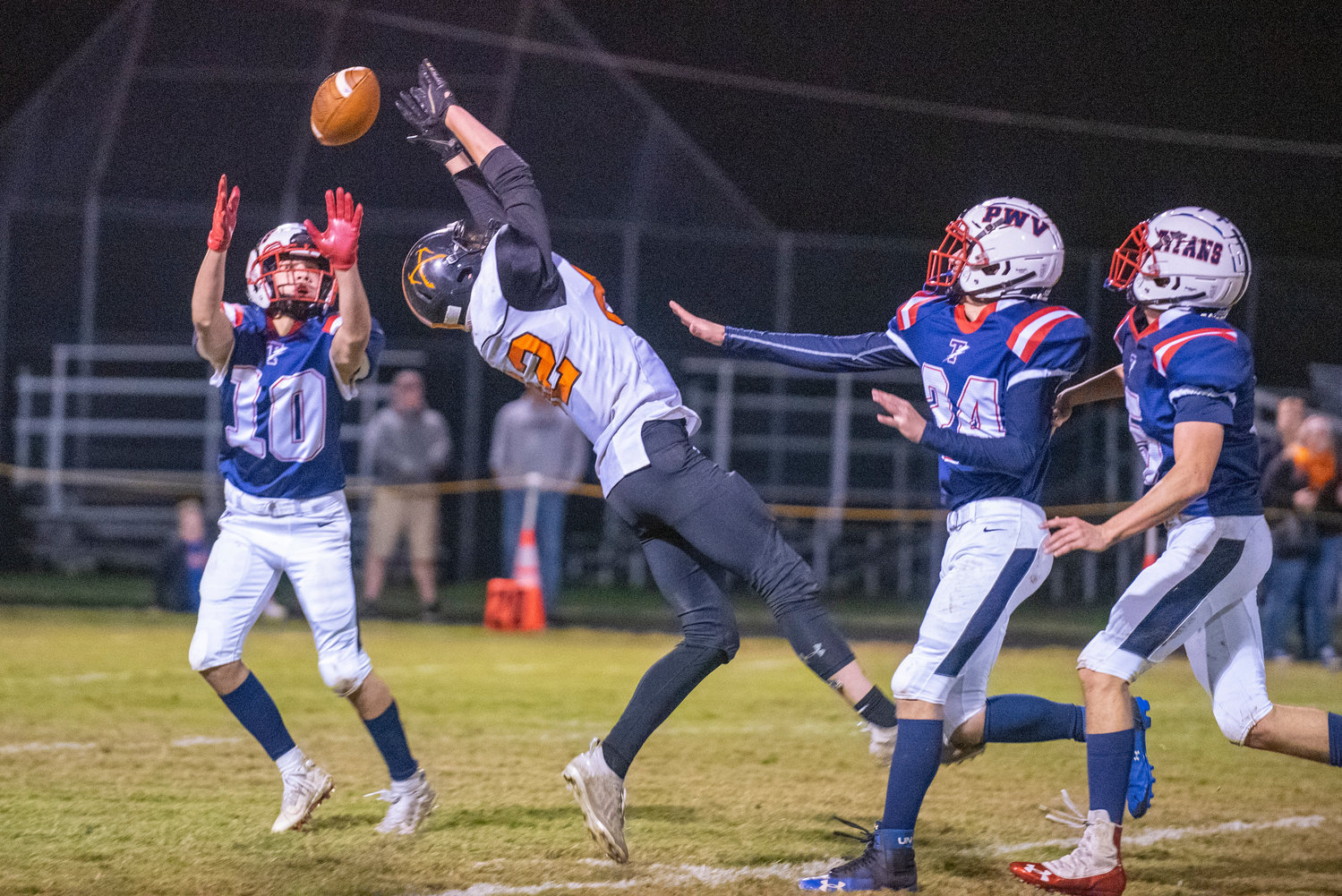 A pass intended for Raineir's Hunter Howell (82) goes flying over his head toward PWV's Tyson Portmann (10) on Oct. 15, 2021 in Pe Ell.