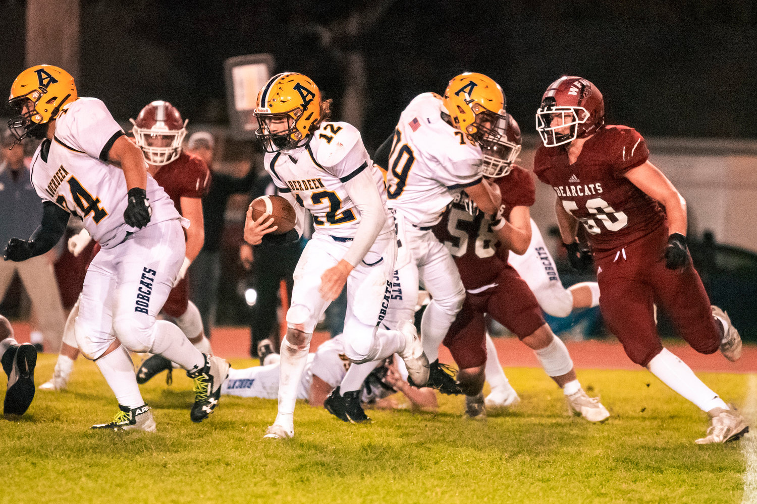 Aberdeen’s Jakob Bowers (12) runs with the football Friday night during a game against W.F. West.
