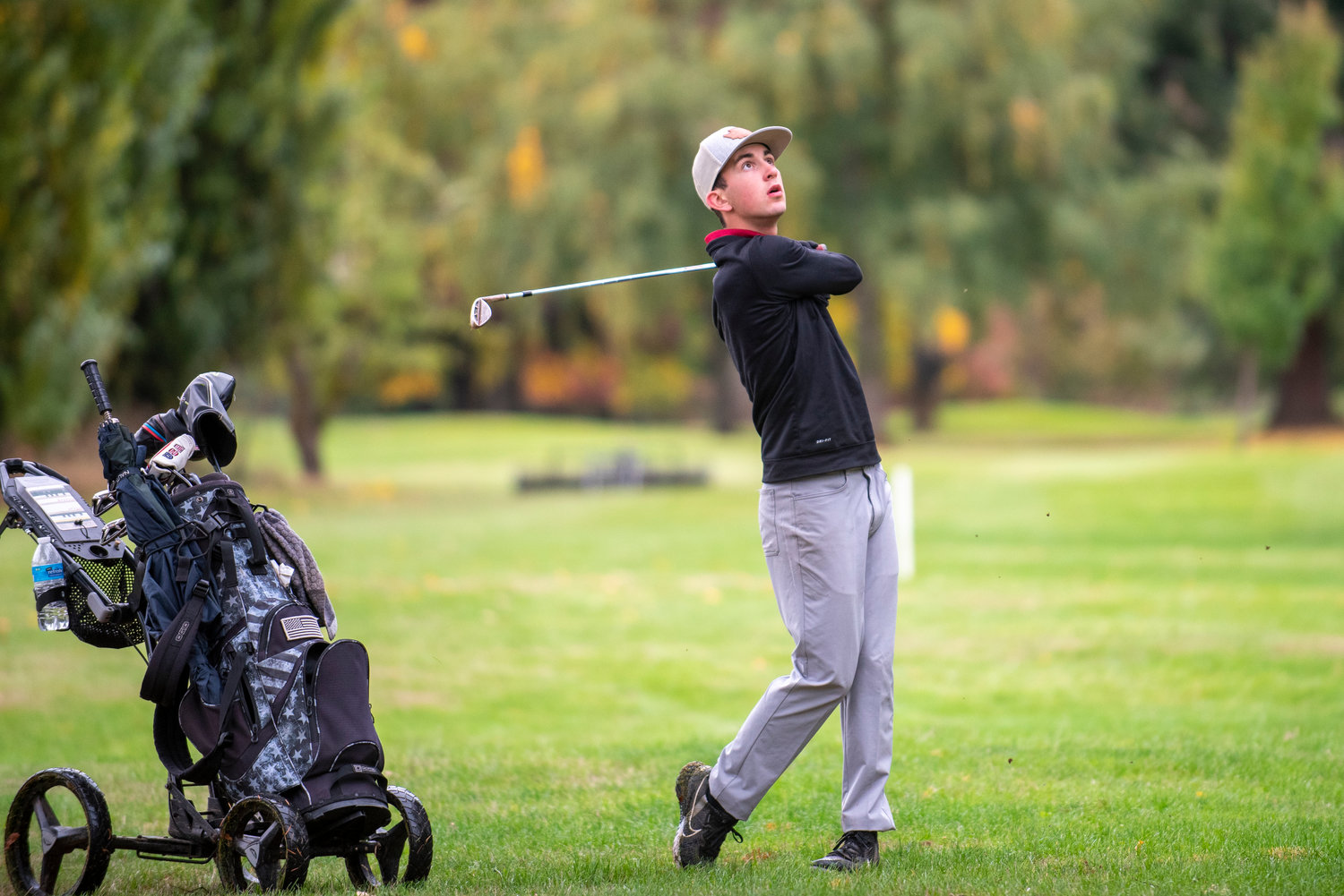 W.F. West's Brock Bunker hits a shot toward the 17th hole during the 2A Evergreen Conference championships at Riverside Golf Course on Oct. 18, 2021.