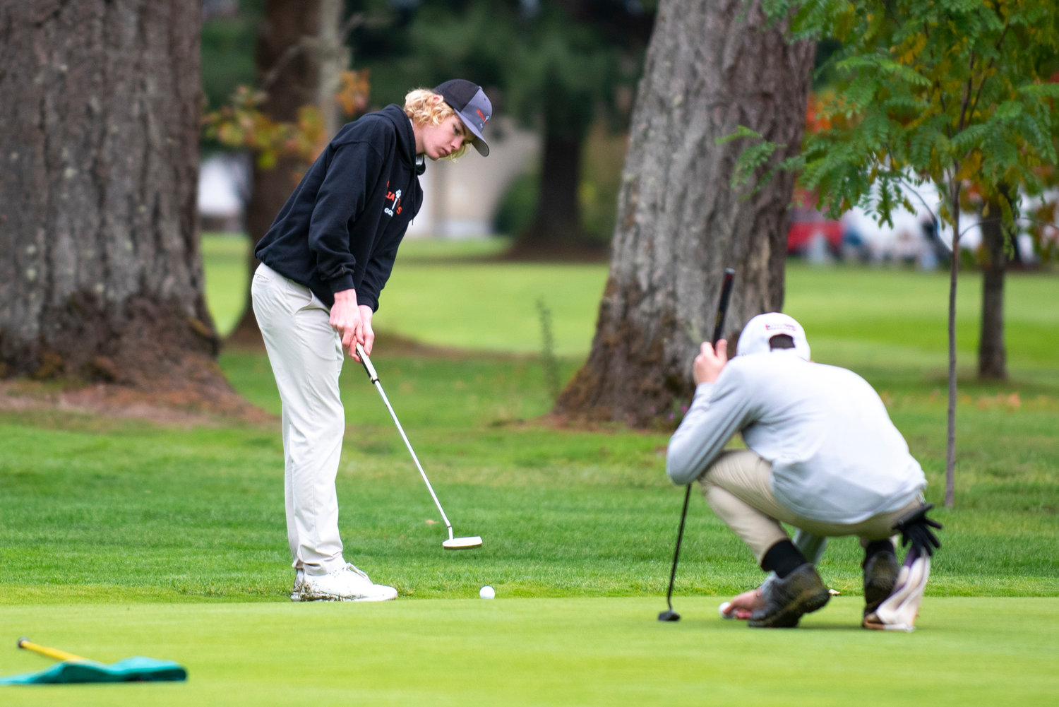 Centralia sophomore Von Wasson putts on the final hole during the 2A Evergreen Conference championships on Monday, Oct. 18, 2021, at Riverside Golf Course.