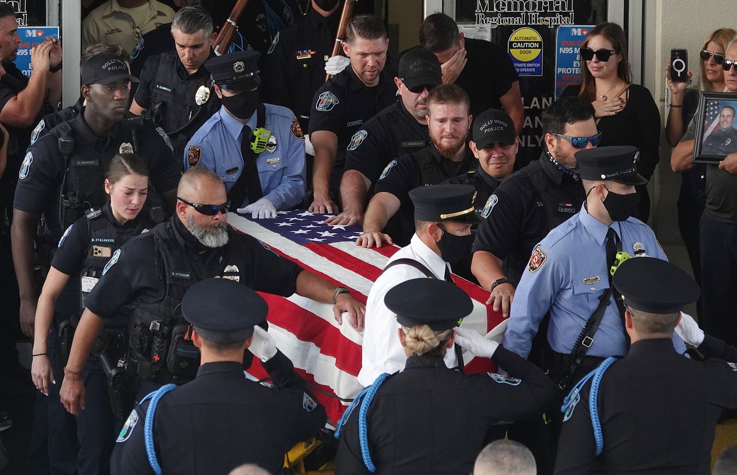 The transfer of the remains of slain Hollywood Police Officer Yandy Chirino takes place at Memorial Regional Hospital in Hollywood, Florida, on Monday, Oct. 18, 2021. Chirino was killed during a late-night altercation with a teenage suspect and died at the hospital. (Joe Cavaretta/South Florida Sun Sentinel/TNS)