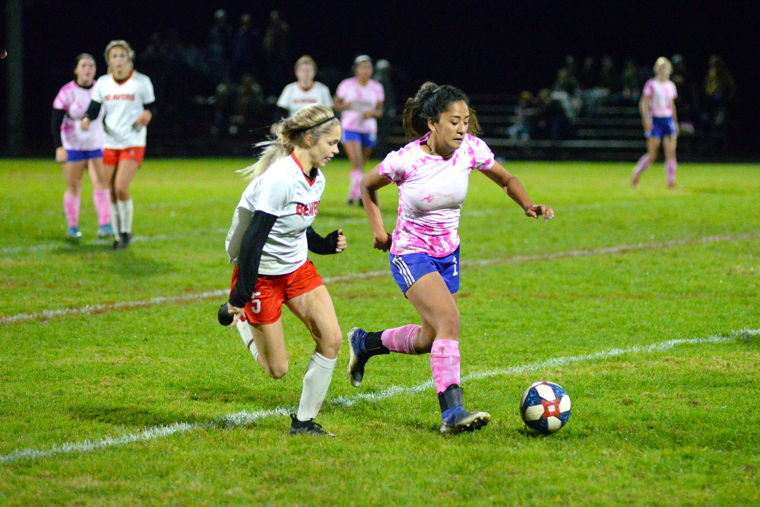 Tenino's Morgan Miner, left, chases down an Elma player on Oct. 19, 2021.
