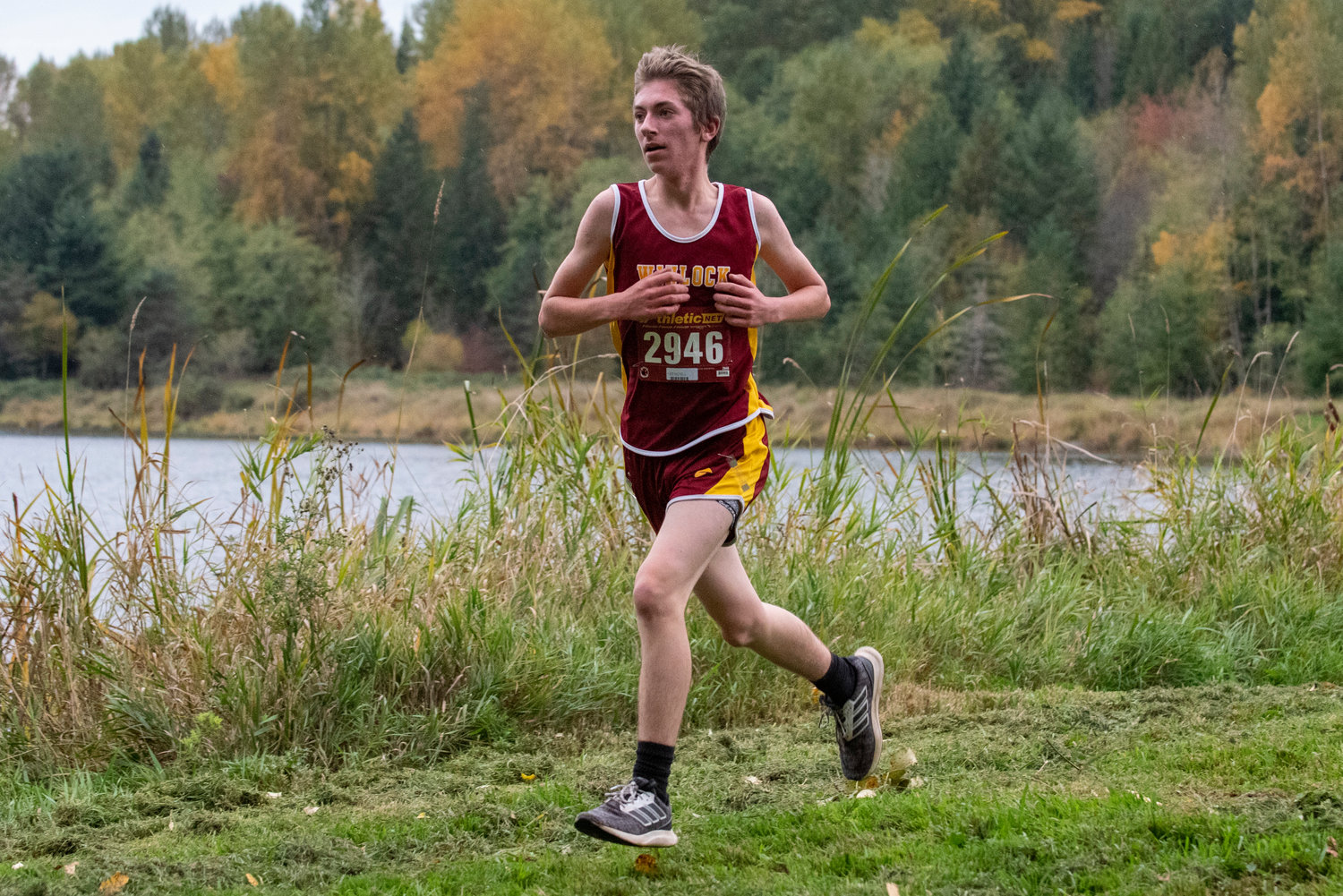 Winlock freshman Chase Trodahl runs along Lake Carlisle during the 2B Central League cross country championships on Oct. 21, 2021.