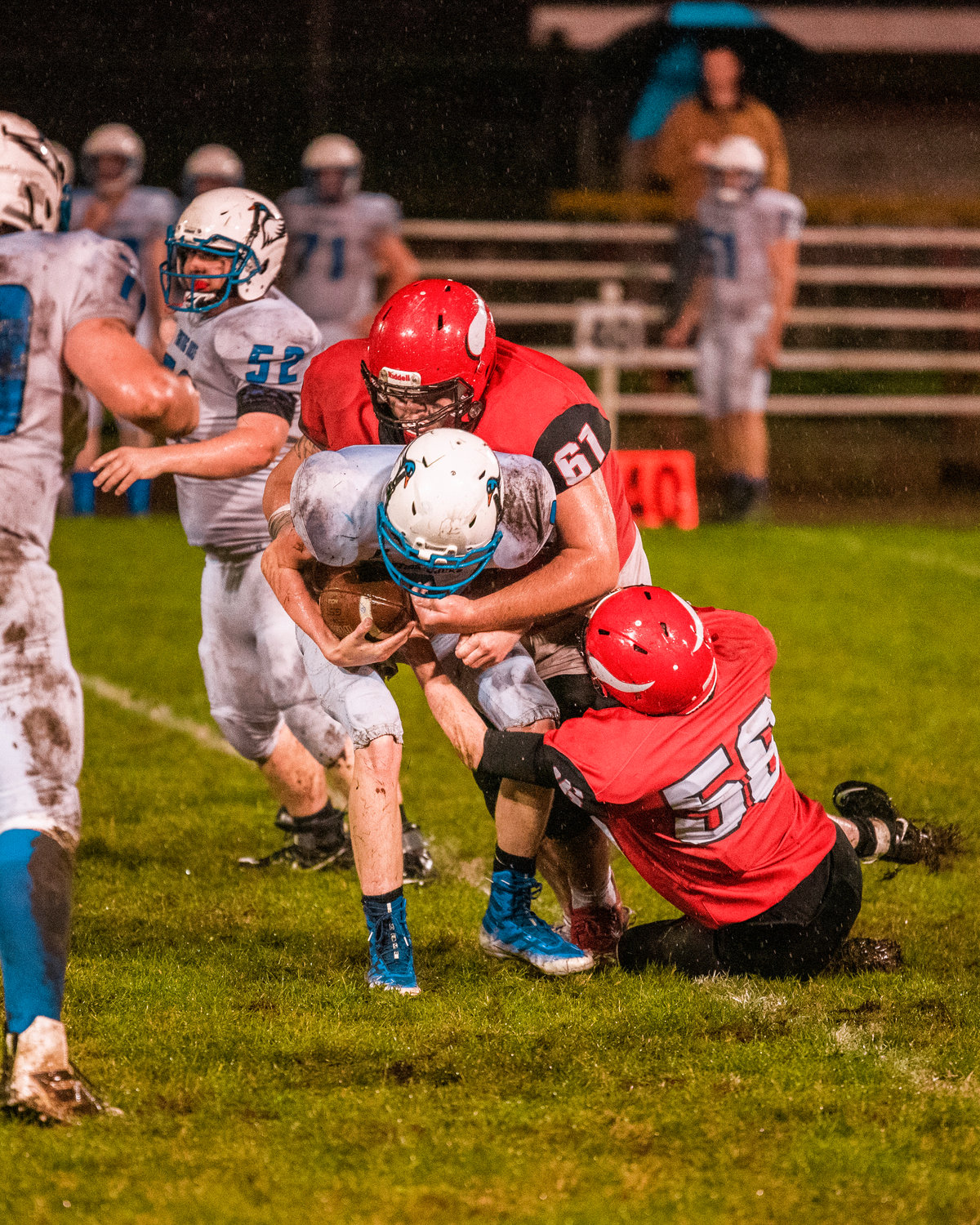 Vikings defenders Ryan Haenke (61) and Brenden Cornelius (56) make a tackle for a sack Thursday night during a game against Toutle Lake.