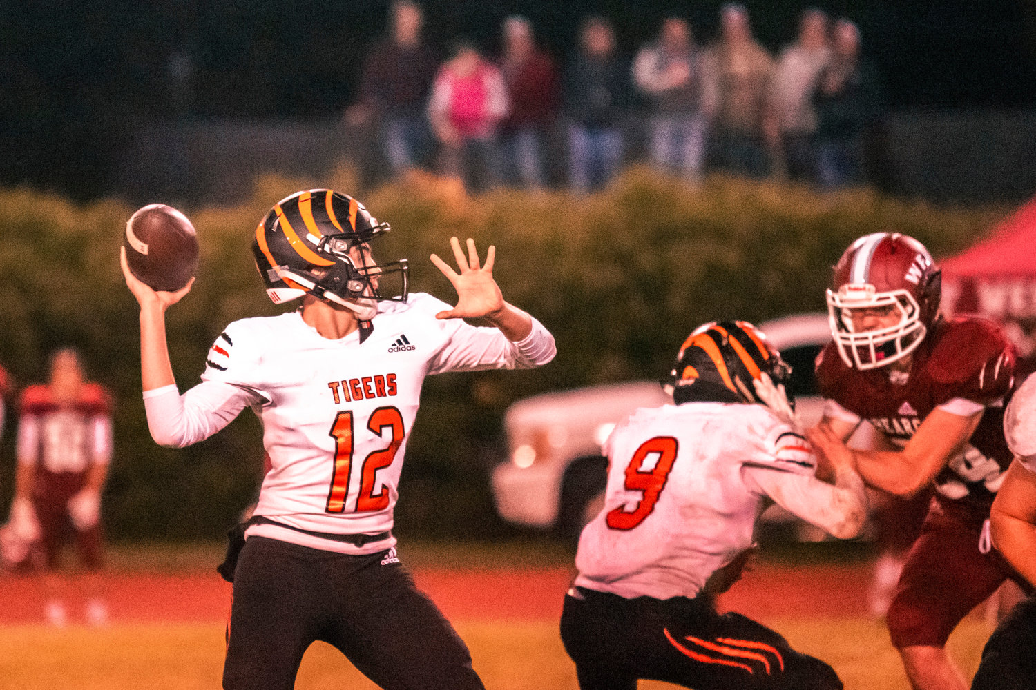 Centralia’s Quarterback Tommy Billings (12) looks to throw during the Swamp Cup game Friday night in Chehalis.