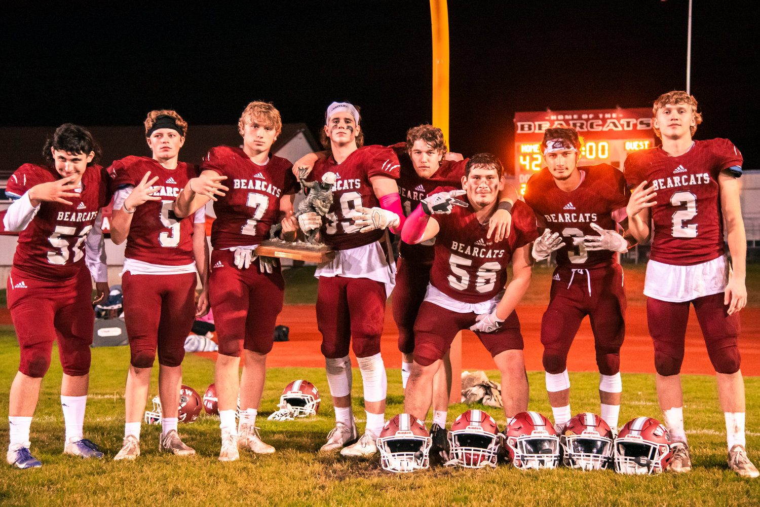 Bearcat seniors pose for a photo with the Swamp Cup trophy following a 42-8 victory over Centralia Friday night.