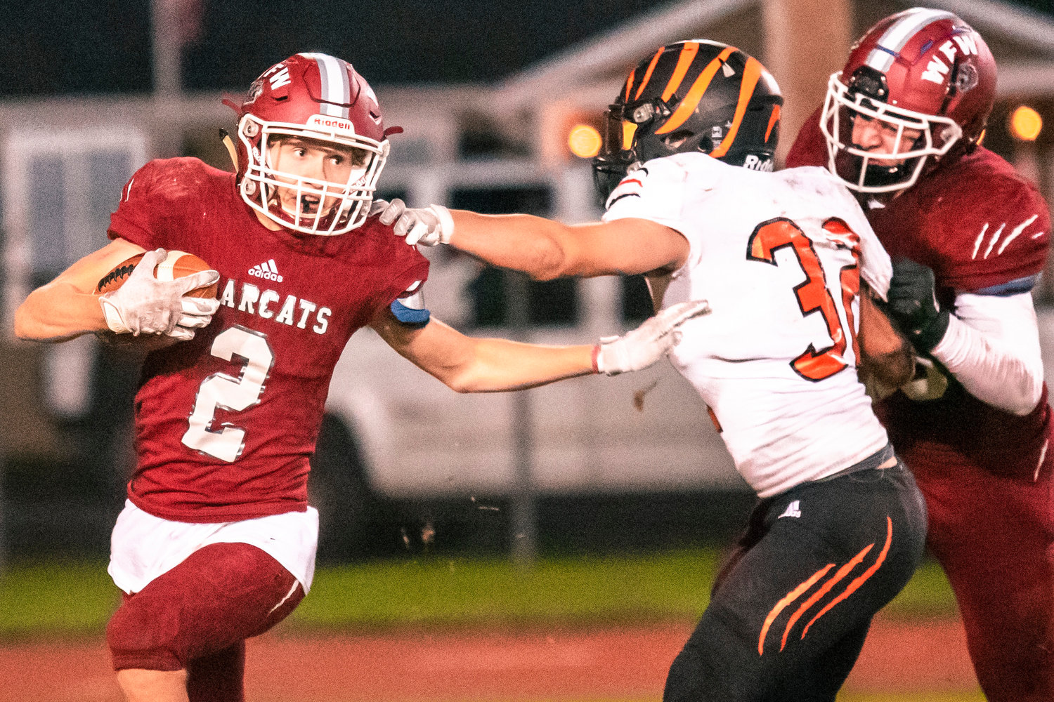 W.F. West’s Jacob Fuller (2) escapes trouble while running with the football Friday night during the Swamp Cup game at Bearcat Stadium.