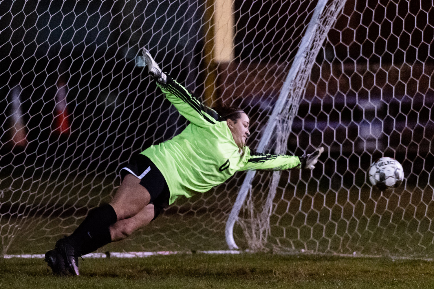 Onalaska keeper Alex Cleveland-Barrera stretches for a ball just outside her reach in PKs against Toledo Oct. 25.