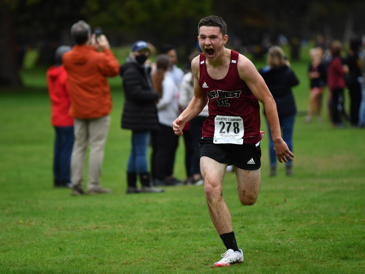 W.F. West senior Jayden Haga lets out a yell as he finishes his race at the District 4 Cross Country Championships Oct. 28.