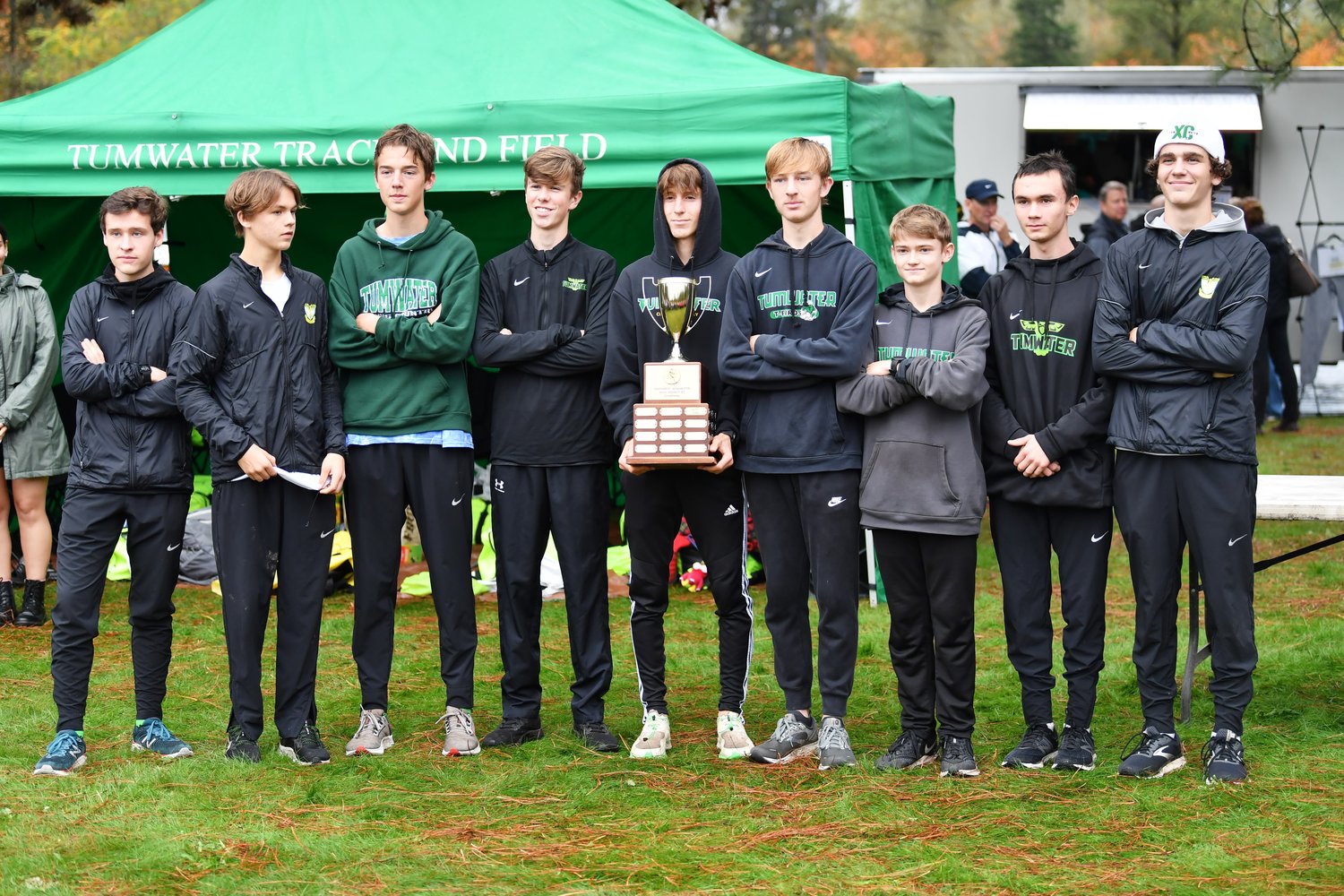 The Tumwater boys team poses with the district championship trophy after the District 4 Cross Country Championships Oct. 28.