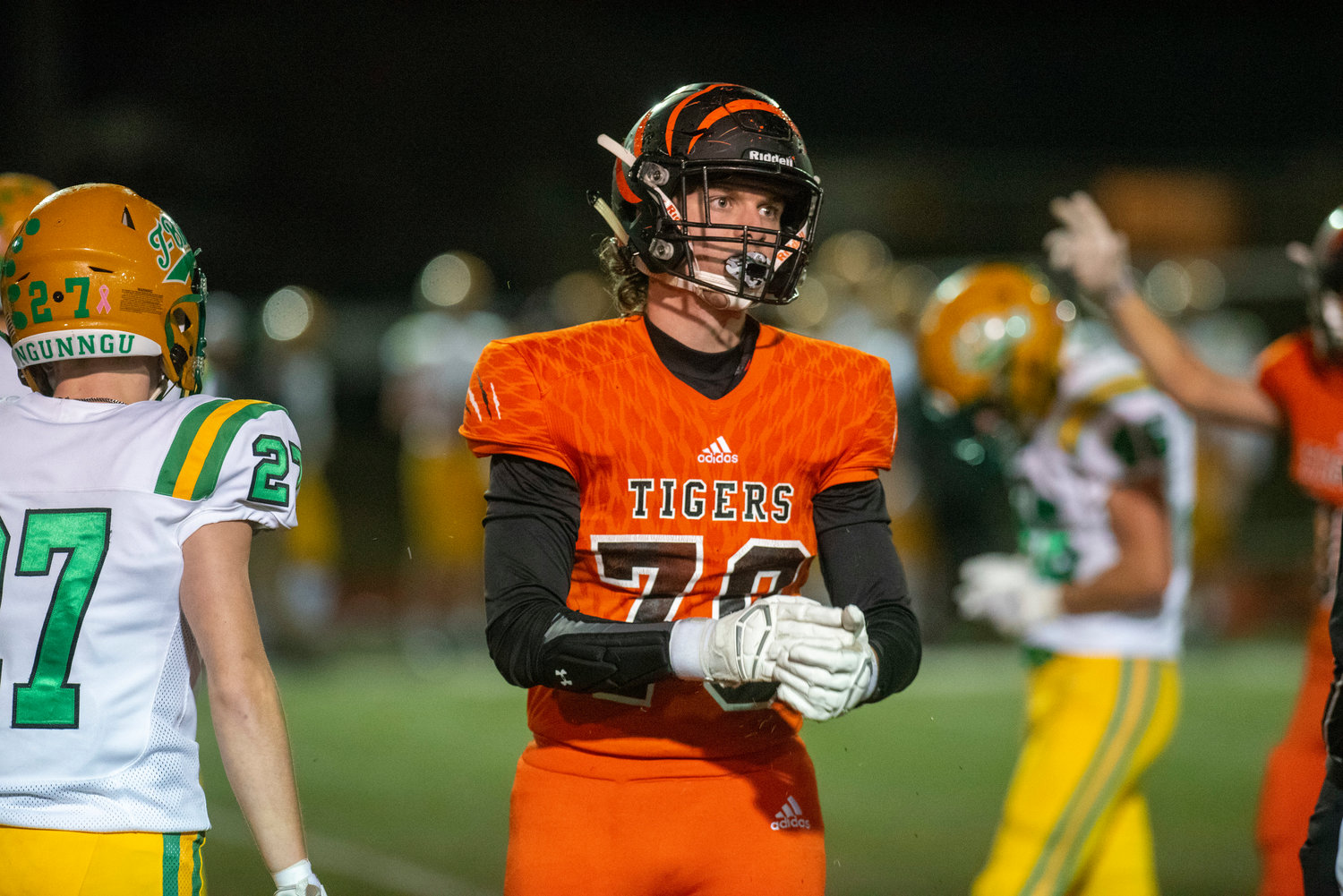 Centralia’s Colton Aitken (70) looks toward the Tigers’ sideline after making a tackle against Tumwater Oct. 29.