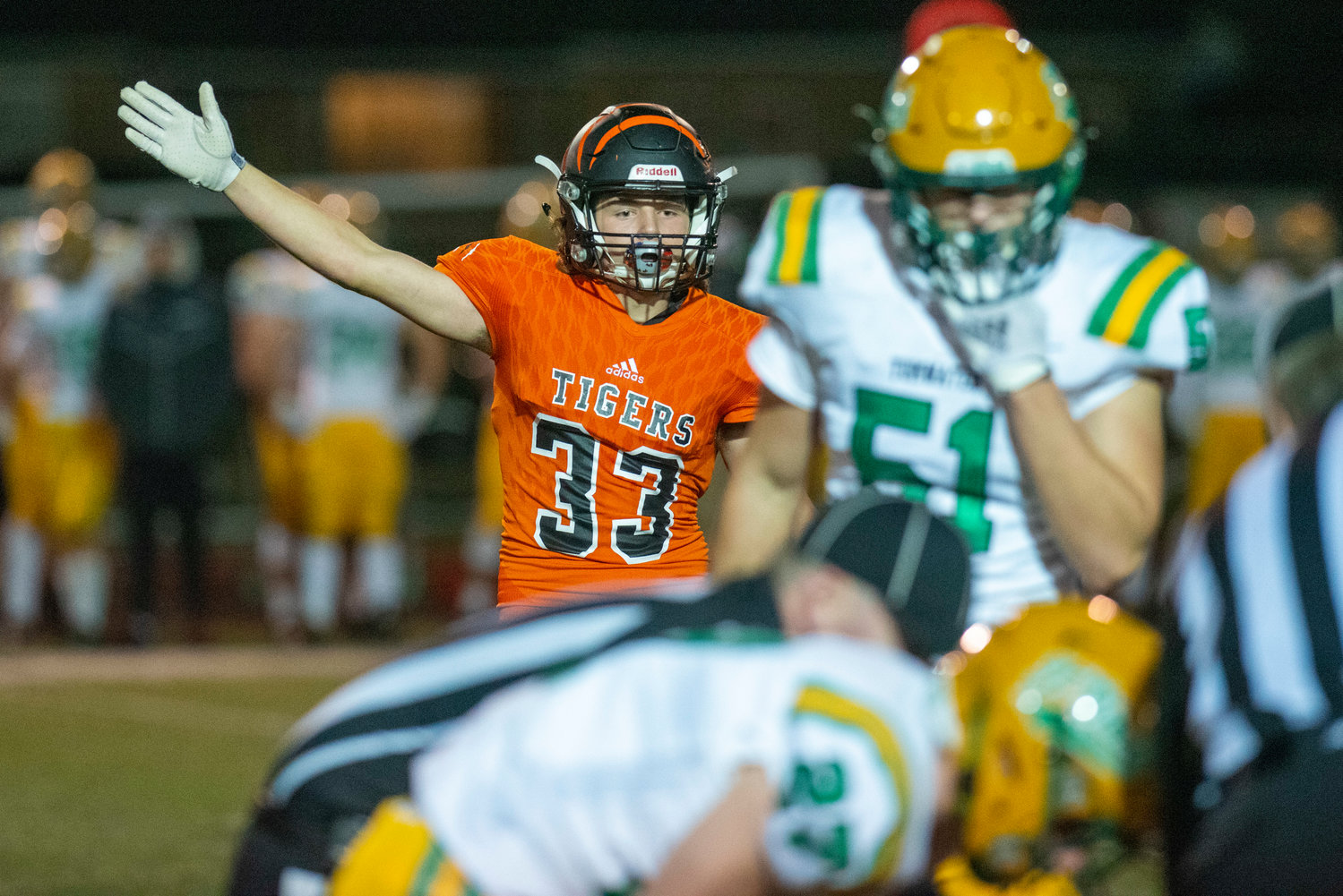 Centralia’s Blake Seymour (33) signals a first down for the Tigers against Tumwater at Tiger Stadium Oct. 29.