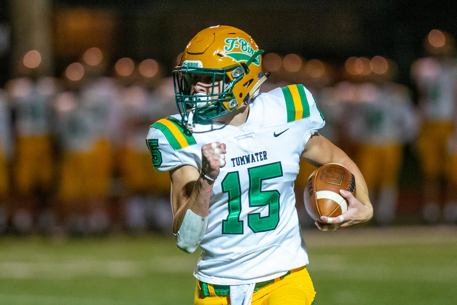 FILE PHOTO -- Tumwater’s Ashton Paine (15) rushes for a first-quarter touchdown against Centralia Oct. 29.