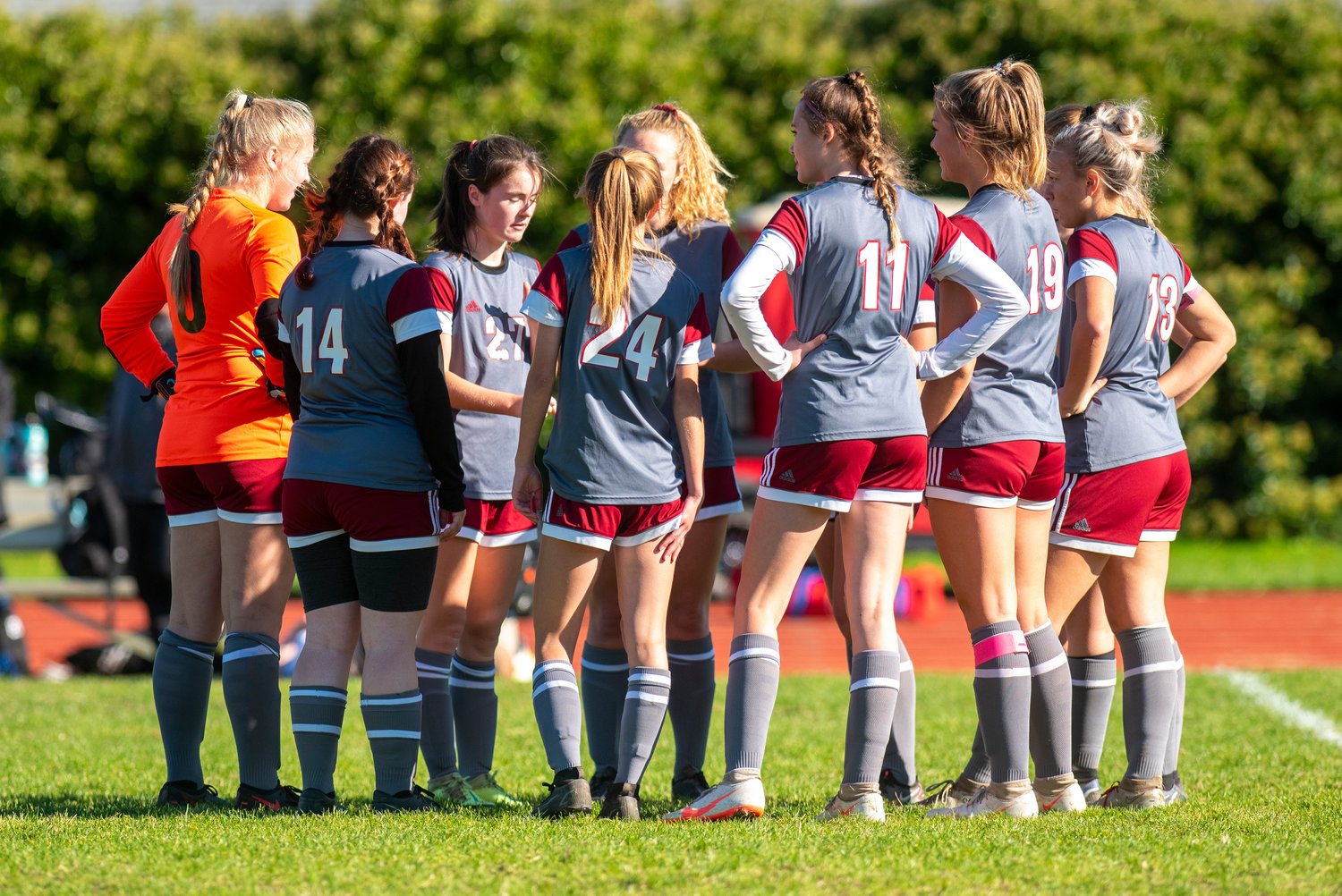 W.F. West girls soccer team talks during an injury timeout in a game against Ridgefield on Saturday.