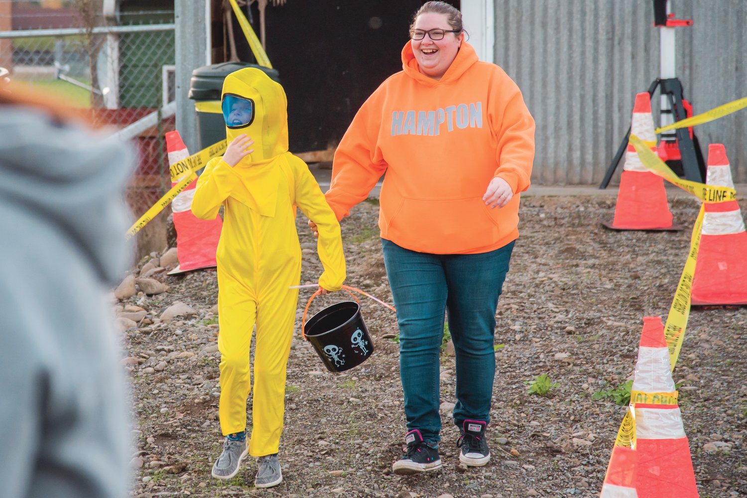 Maddie, 9, fixes her head after taking a walk through the Lewis County Fire District #4 Haunted House in Morton while dressed as a crewmate from "Among Us" on Halloween.