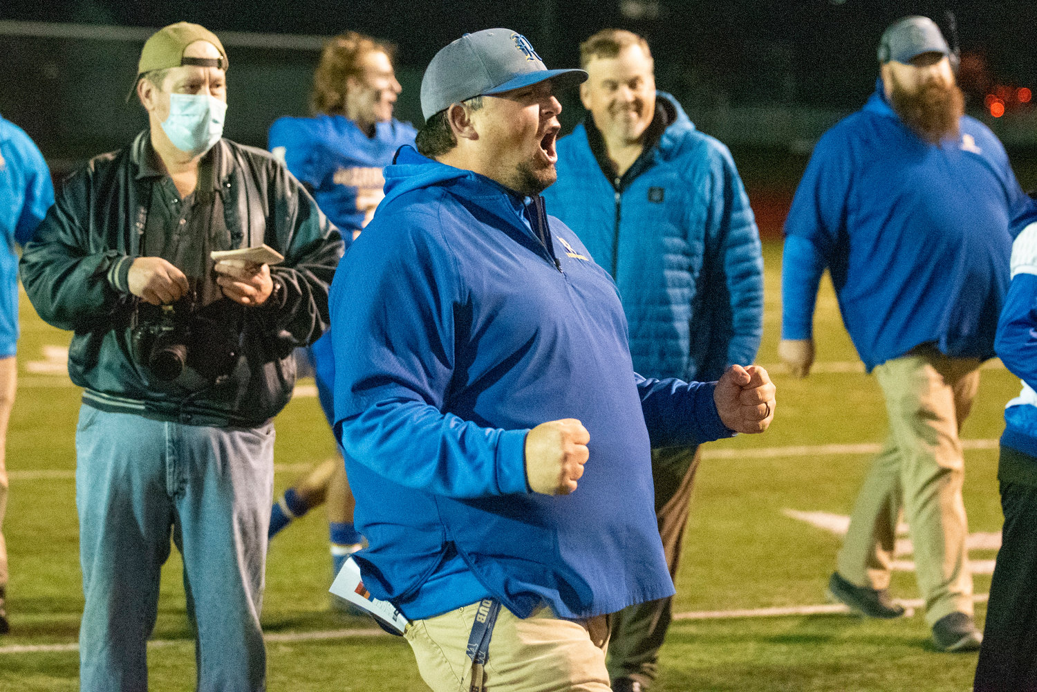 Rochester head coach A.J. Easley yells in celebration after the Warriors clinch the No. 3 seed in the 2A District 4 crossover playoffs Monday at Tiger Stadium.