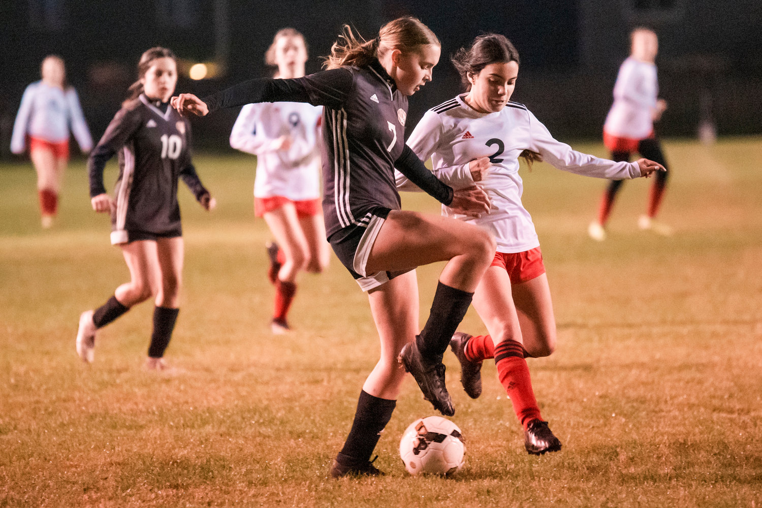 Napavine’s Haley Gallagher (7) and Toledo’s Jazzy Zarate (2) fight for possession of the ball during a game Monday night.
