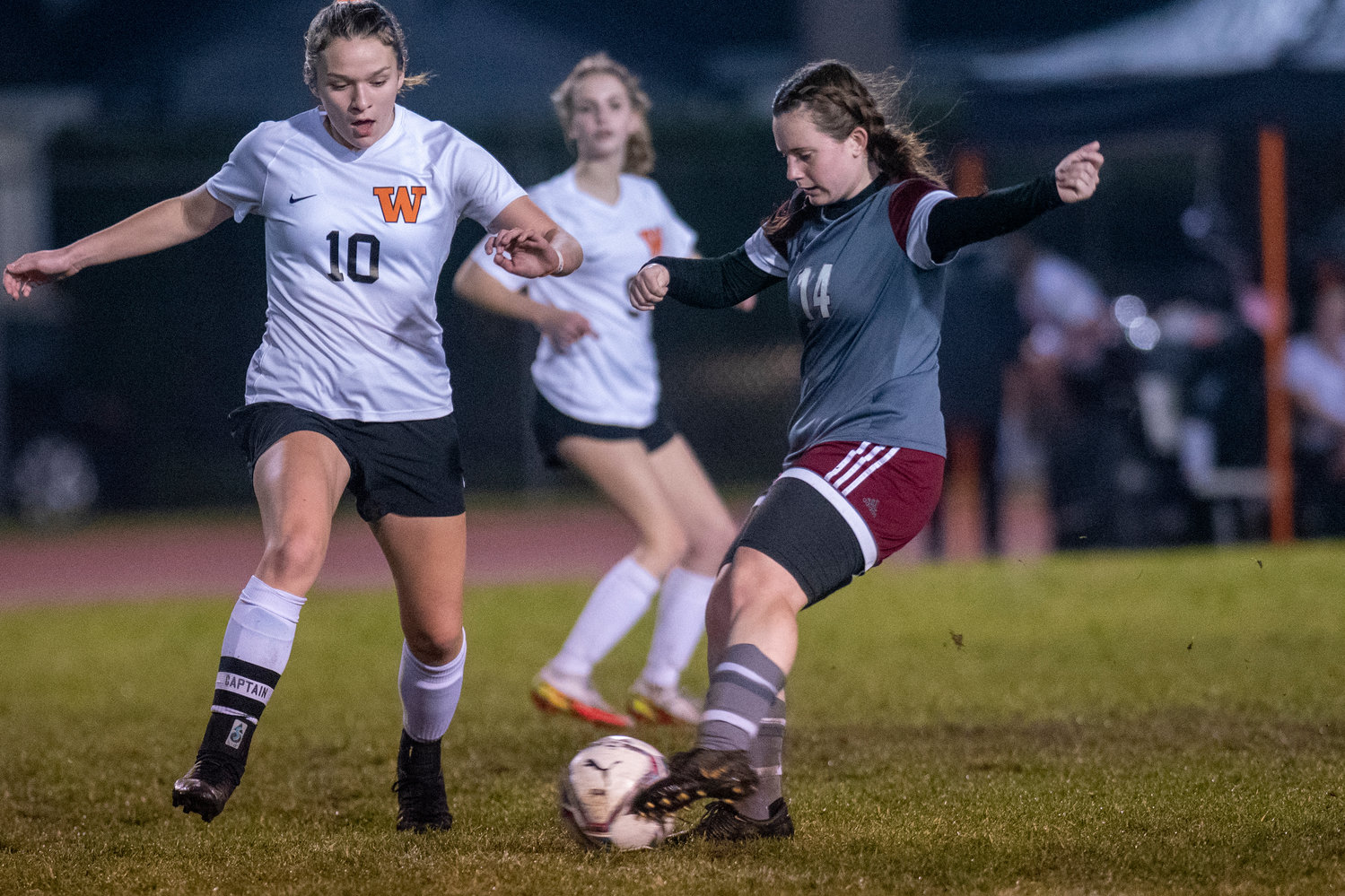 W.F. West's Madeline Shields (14) keeps the ball away from Washougal's Lauren Rabus (10) during a district playoff match Tuesday, Nov. 2.