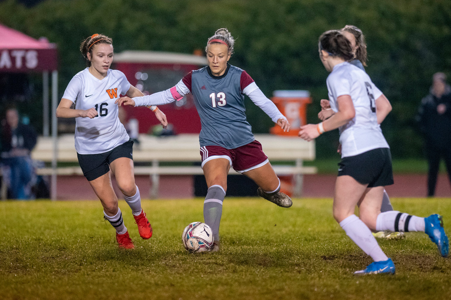 W.F. West's Cam Sheets (13) battles with two Washougal players in a district playoff match Tuesday, Nov. 2.