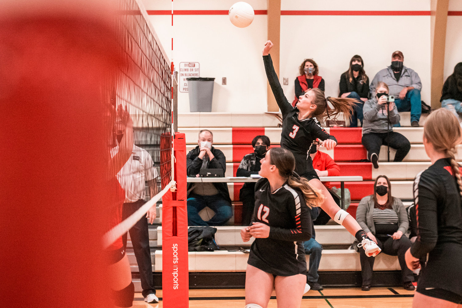 Mossyrock’s Erin Cournyer (3) goes up to return a ball during a District 4 1B Volleyball Tournament matchup against Oakville Tuesday in Mossyrock.