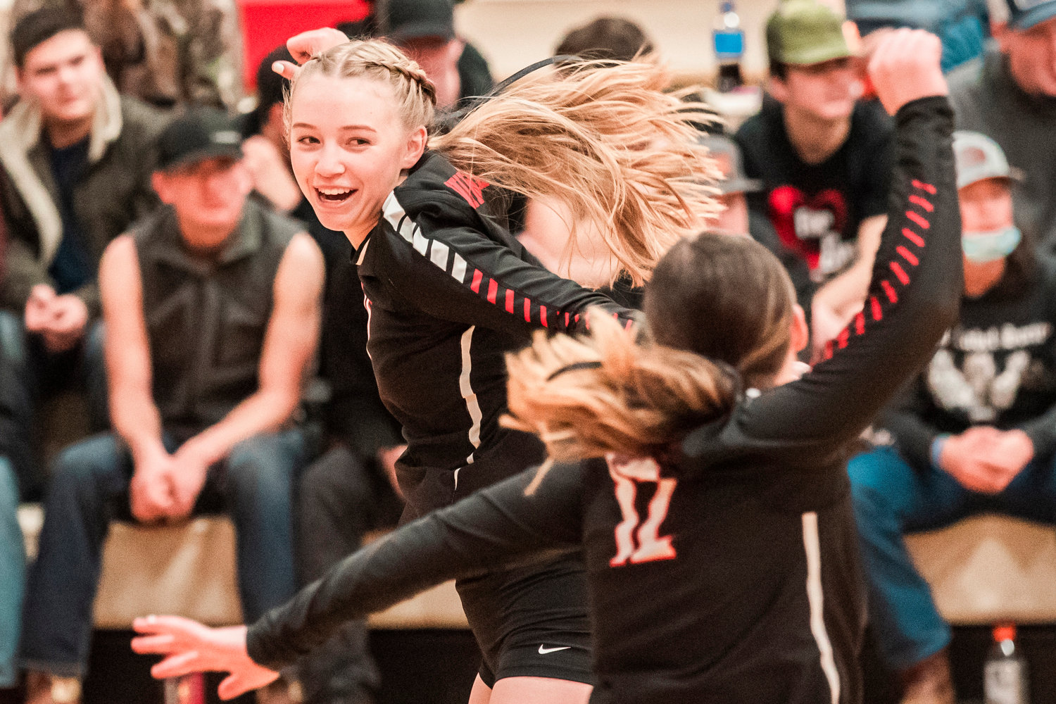 Vikings celebrate a score during a District 4 1B Volleyball Tournament matchup against Oakville Tuesday in Mossyrock.