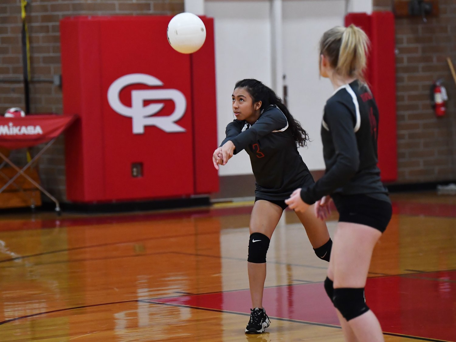 Tenino sophomore Natalie Davis digs up a serve in an opening round loss to Castle Rock in the 1A District 4 playoffs Nov. 3.