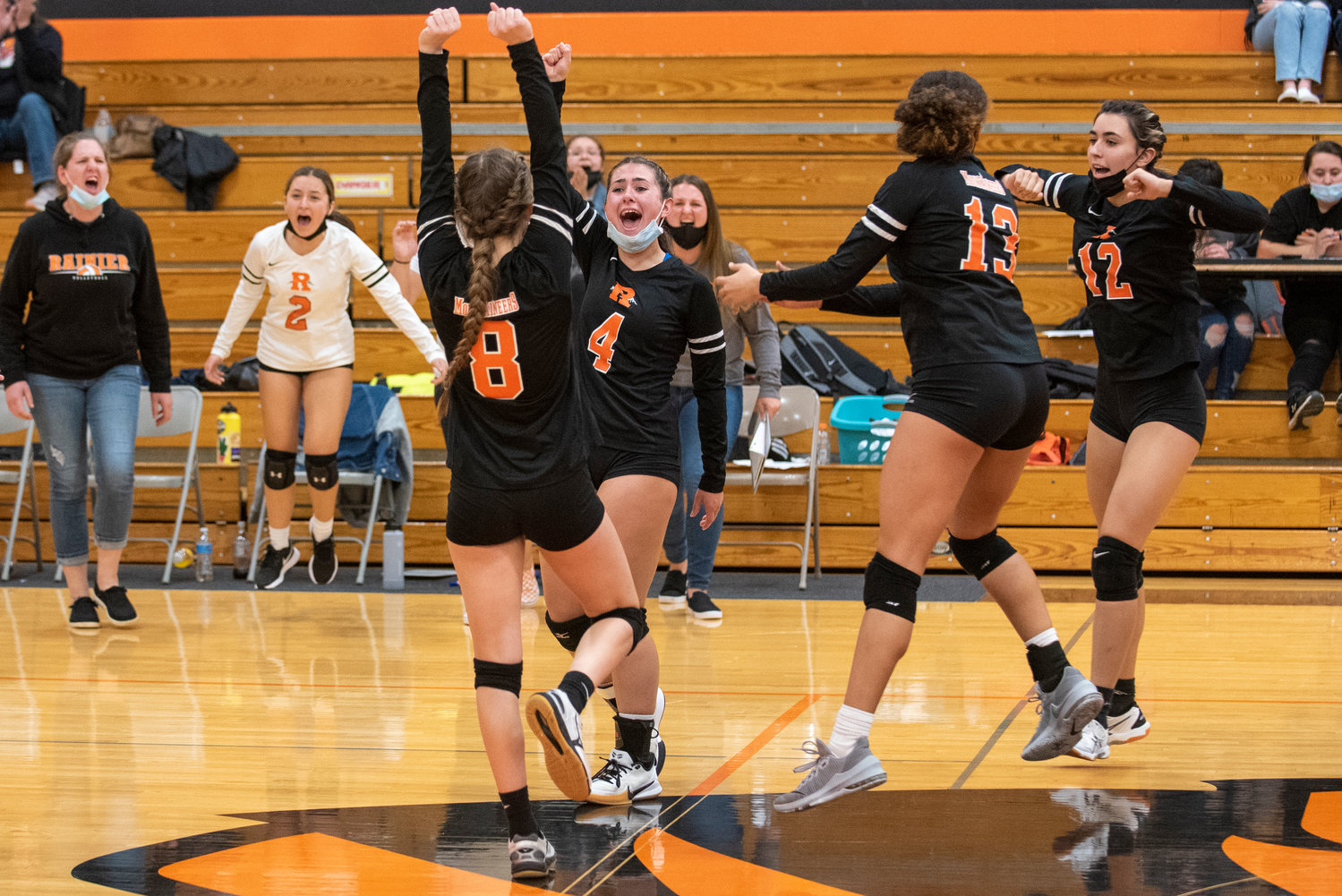 Rainier celebrates during a state-clinching victory over Forks in the distrit playoffs Wednesday at Napavine High School.