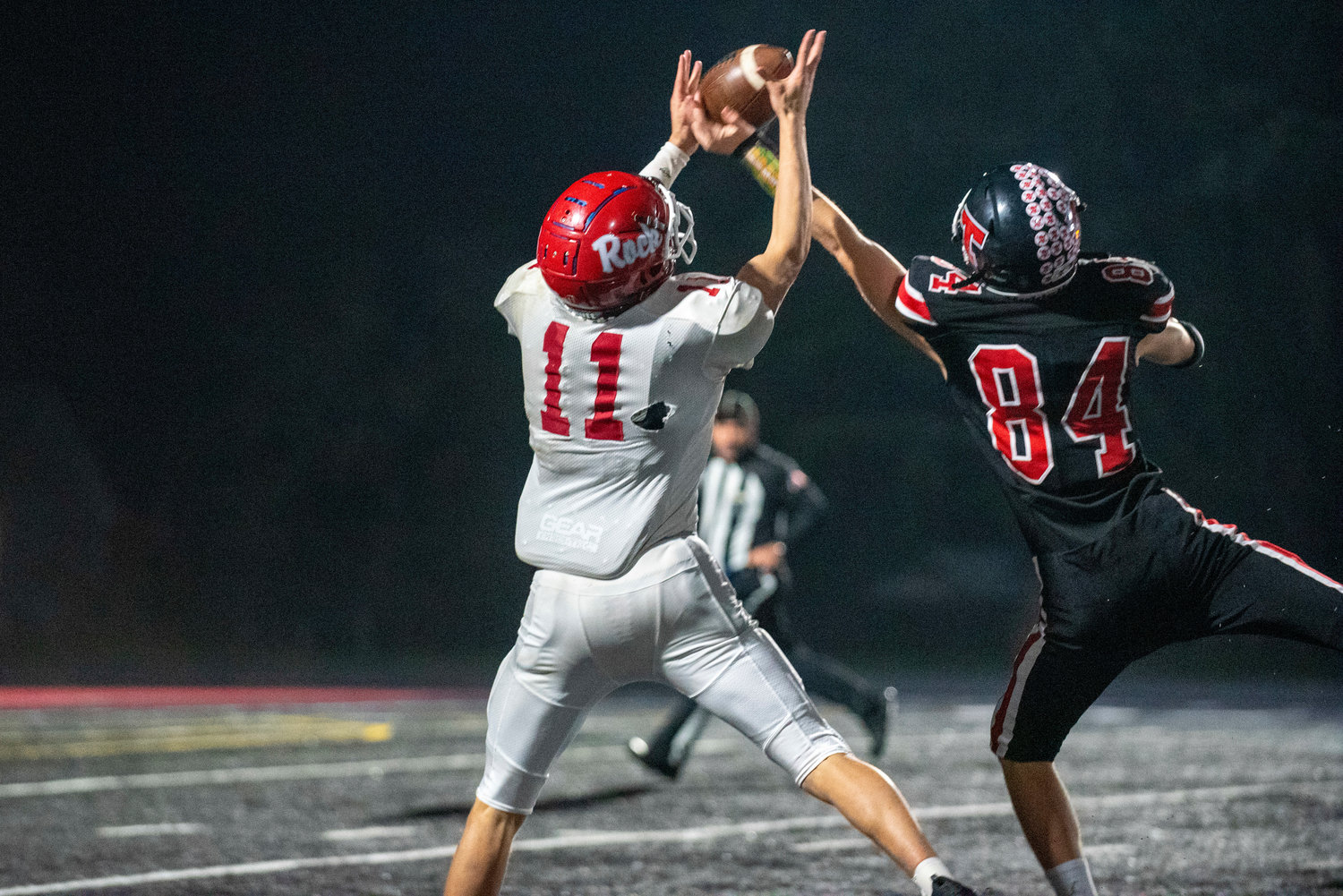 Tenino's Keegan O'Connor (84) breaks up a Castle Rock pass intended for Lane Partridge (11) on Friday, Nov. 5.