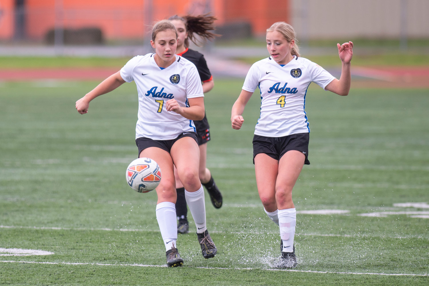 FILE PHOTO -- Adna's Karlee Von Moos (7) and Lydia Tobin (4) get in front of a Kalama kick during the district title match Saturday, Nov. 6.