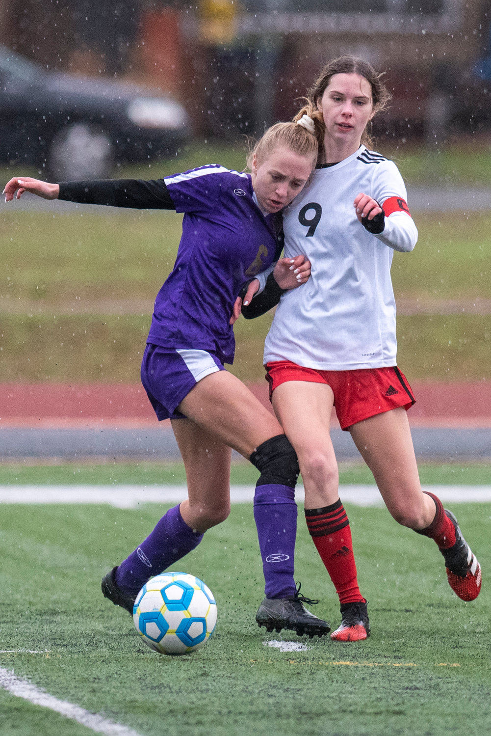 Onalaska's Haille Brown (6) and Toledo's Marina Smith (9) battle for possession during the district tournament Saturday, Nov. 6.