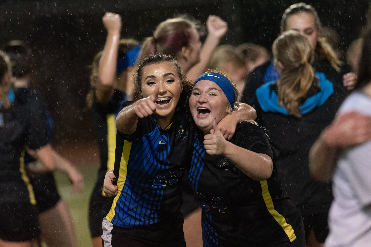 Adna seniors Presley Smith and Sadie Burdick celebrate after beating Cle Elum-Roslyn in the opening round of the state tournament in Tumwater Nov. 10.