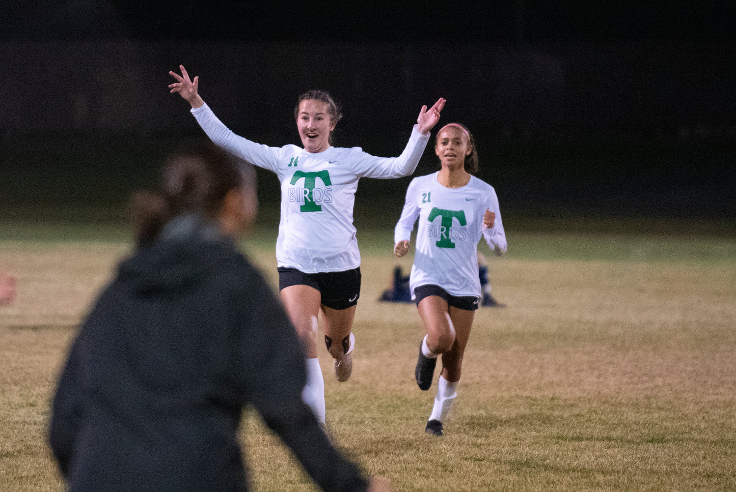 Tumwater’s Austin Laposky (14) and Ava Jones (21) sprint toward the Thunderbirds’ sideline in celebration after defeating Selah, 3-2, in a 2A state opener Wednesday.