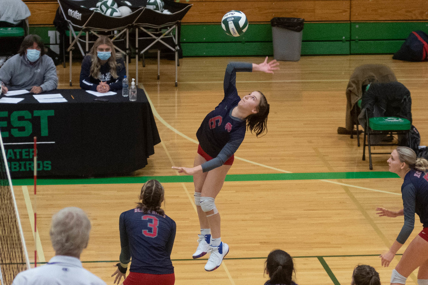 Black Hills outside hitter and defensive specialist Ava Bauer spikes home a kill against R.A. Long in the opening round of the 2A District 4 tournament in Tumwater Nov. 11.