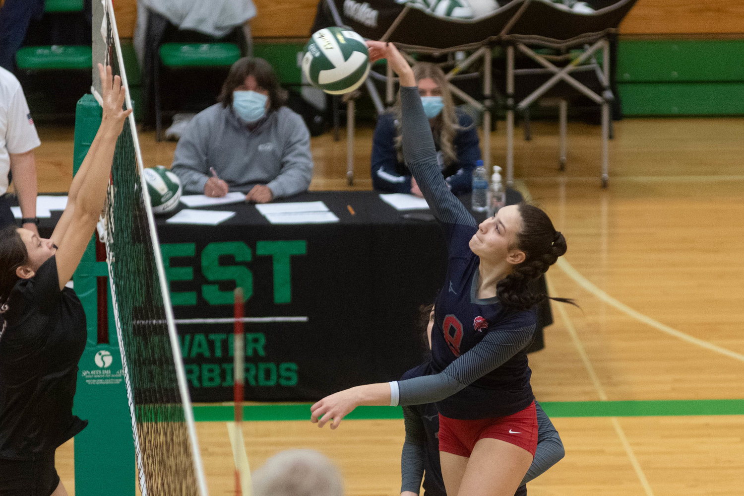 Black Hills middle blocker Payton Childers sends a spike over the net against R.A. Long in the opening round of the 2A District 4 tournament in Tumwater Nov. 11.