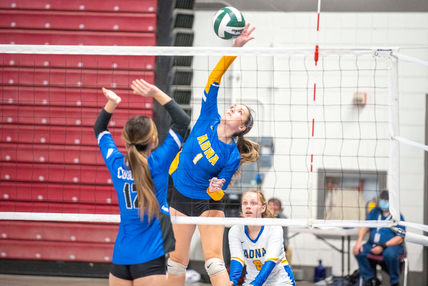 Adna’s Alyssa Davis (1) spikes against Warden in a loser-out match Thursday in Yakima.