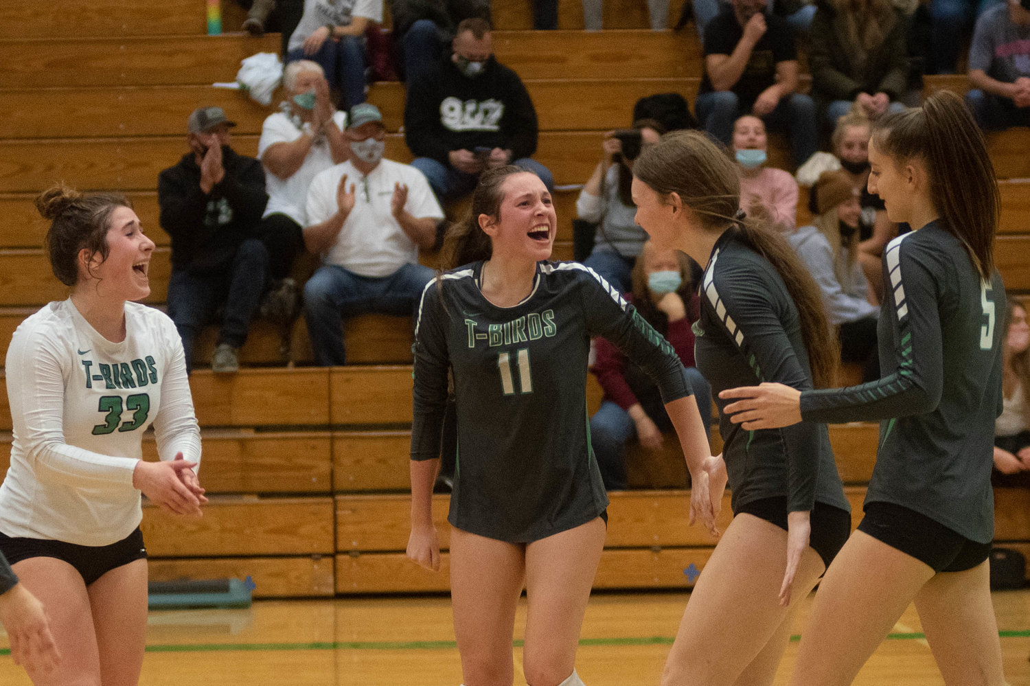 The Tumwater volleyball team celebrates a point against Mark Morris in the opening round of the 2A District 4 tournament Nov. 11.