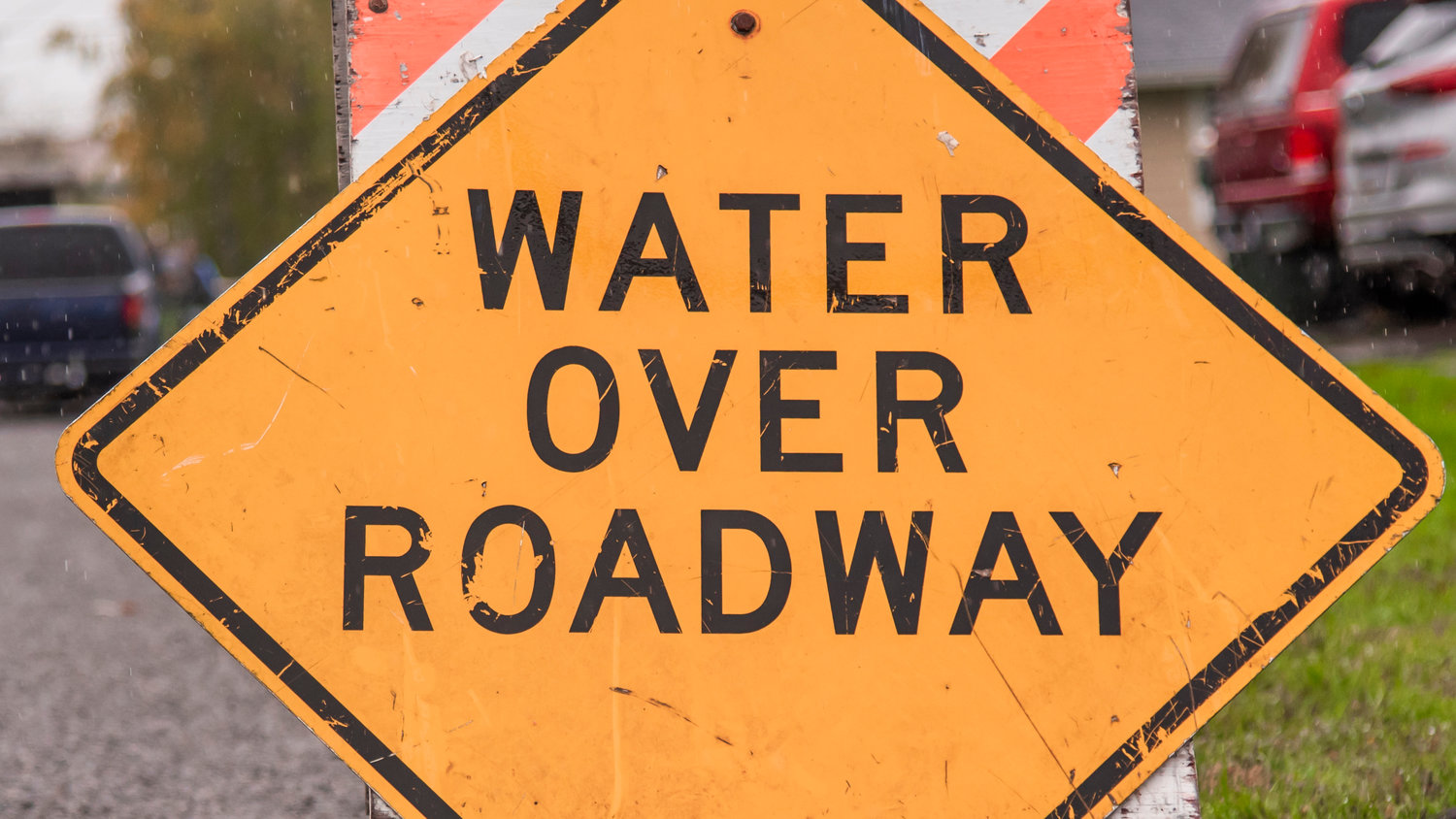 A sign reads, “Water over roadway,” near Southwest William Avenue in Chehalis.
