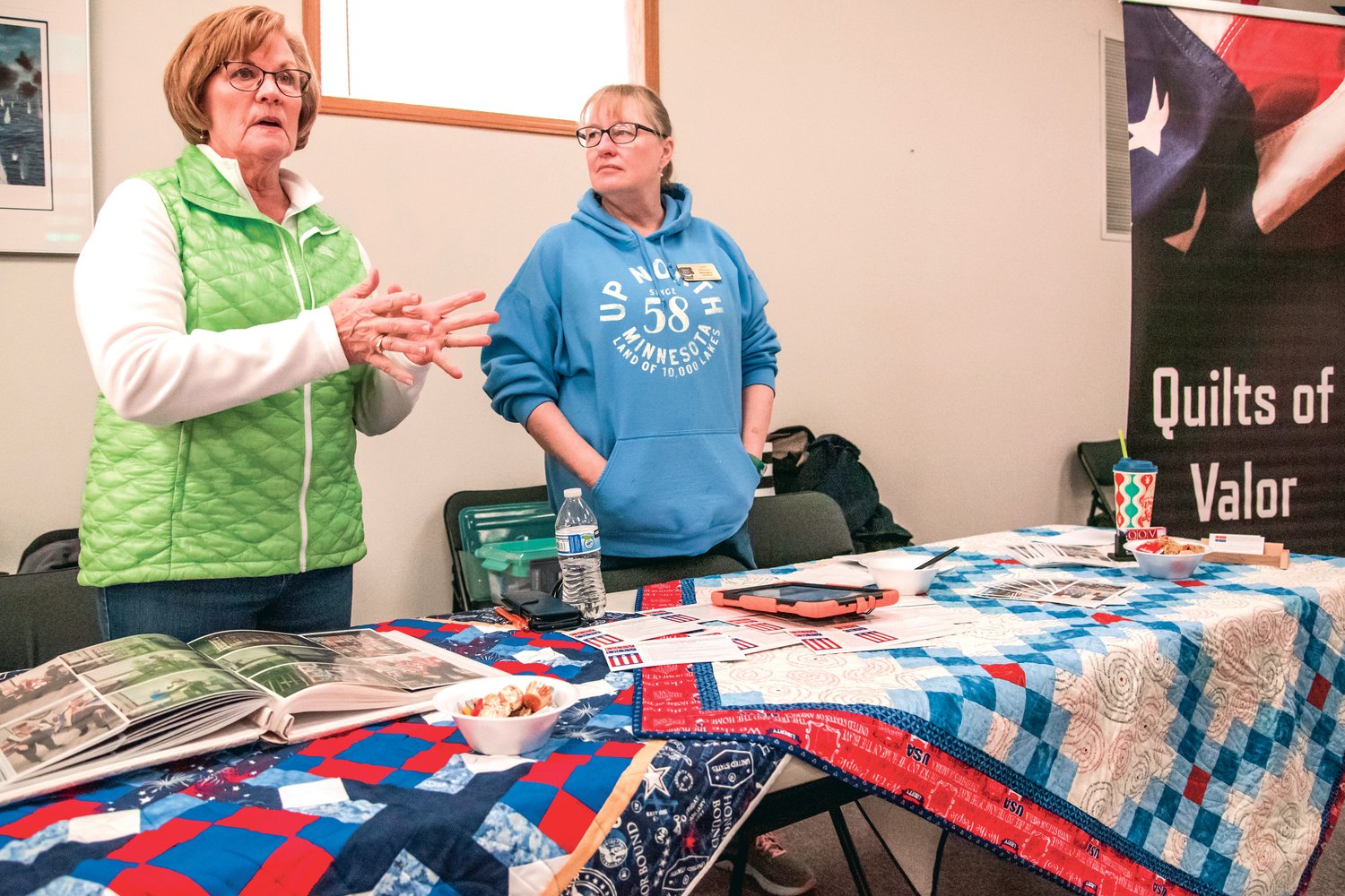 Fay Matson and Lynn Wiltzius, with Quilts of Valor, talking about pieces given to service members at the Veterans Memorial Museum in Chehalis.