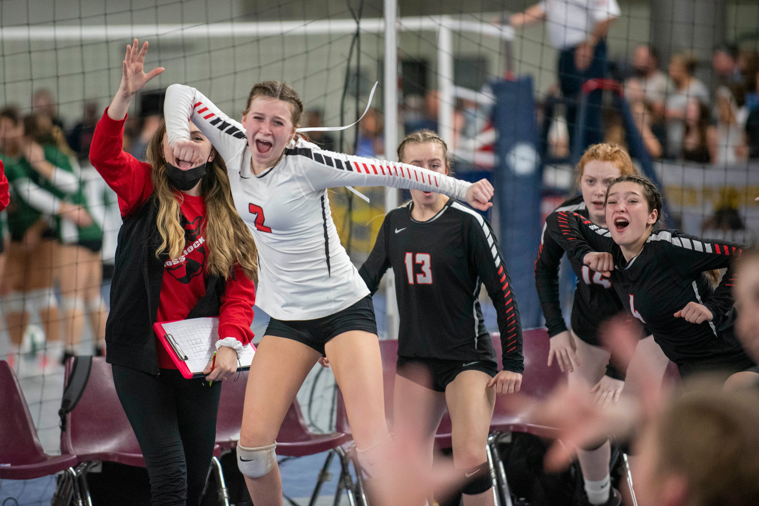 Mossyrock bench erupts in cheers during the 1B state title game against Oakesdale Friday in Yakima.